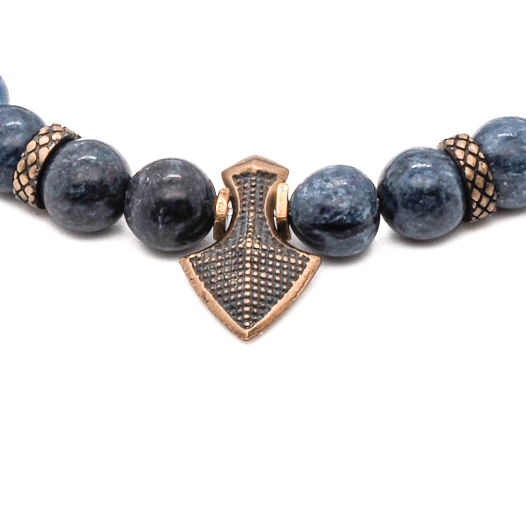 Handmade bracelet featuring calming blue sodalite stones and bronze arrow centerpiece.