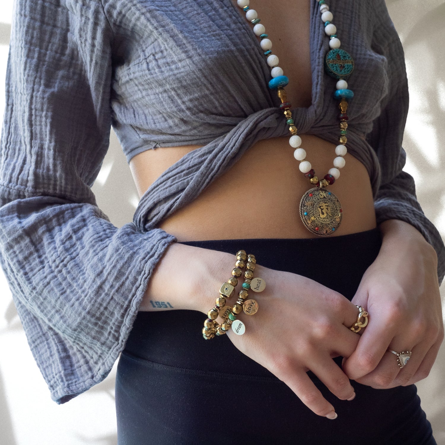 The model wearing the Best Wishes Bracelet showcases how beautifully this piece complements any outfit.