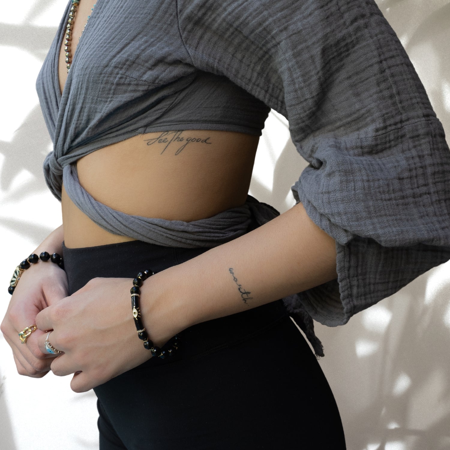 Model Wearing a Chic Black Onyx Bracelet with Evil Eye Charm - Handmade in USA