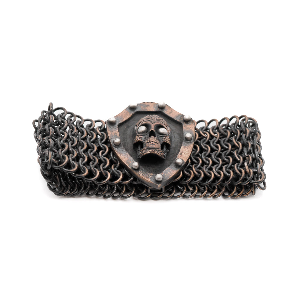 A bold and stylish men's bracelet with a bronze skull charm