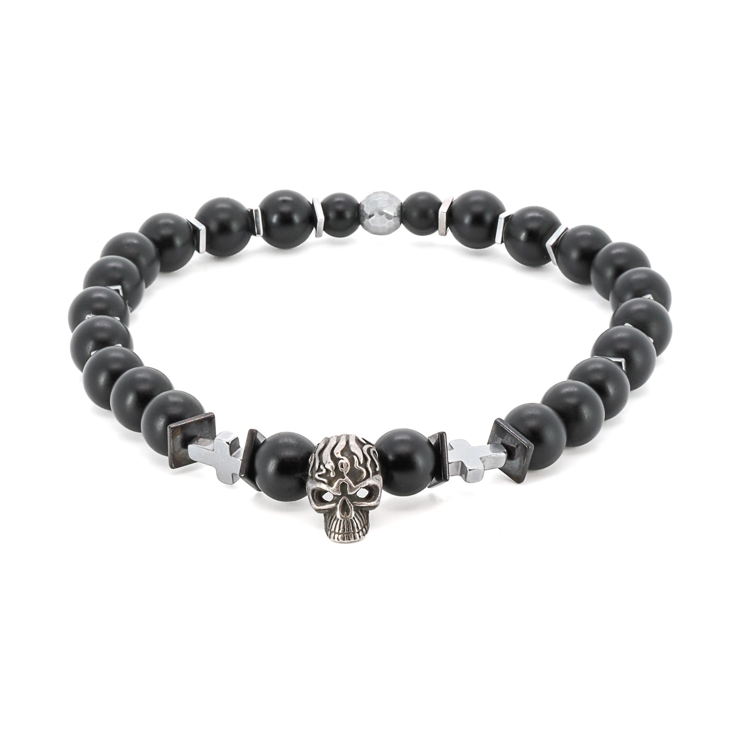 Featuring a sterling silver skull bead at its center, this handmade bracelet symbolizes transformation and embracing the impermanence of life.