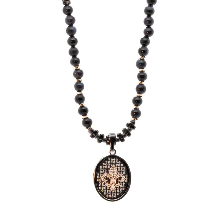 Top view of the Diamond Fleur de Lis Necklace, displaying the mix of rose gold and black hematite beads for a modern and stylish look.
