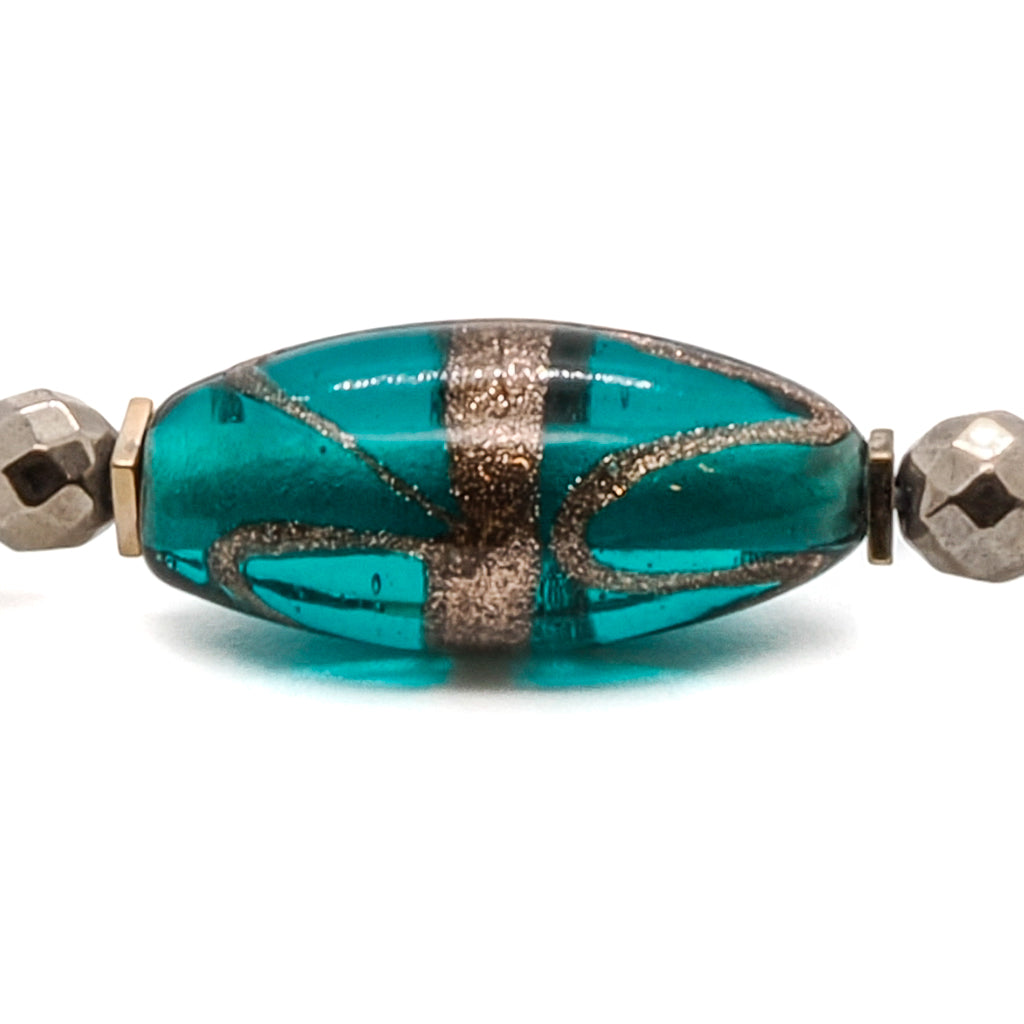 Handcrafted Bracelet with Hematite Stone and African Bead, combining protective energies and vibrant colors.
