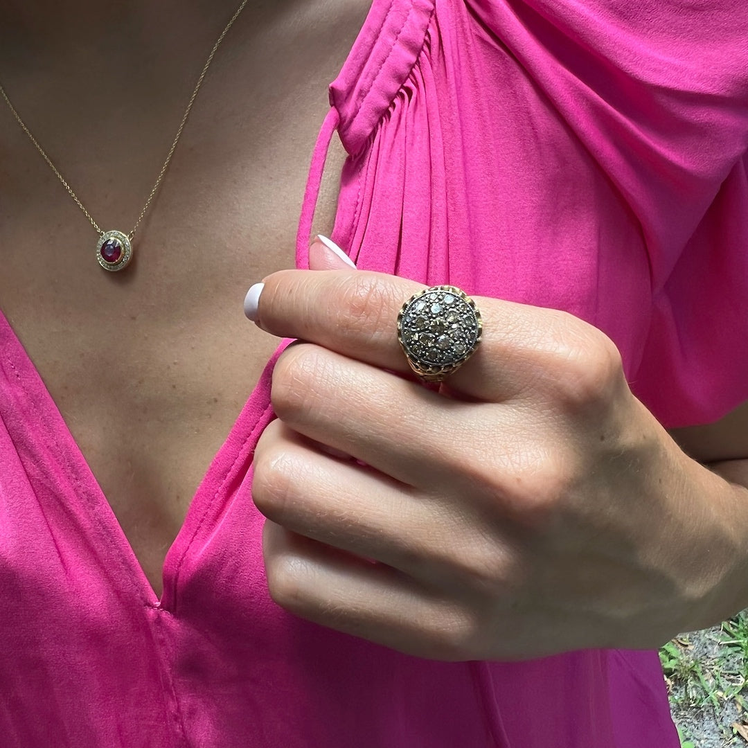 Hand model wearing the Elegant Handcrafted Gold and Diamond Ring, showcasing its exquisite design and the beauty of the brown diamonds.