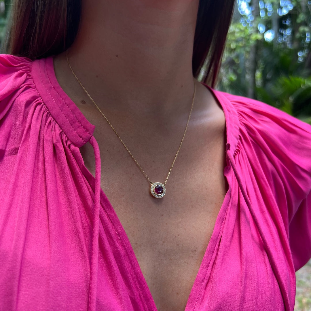 Close-up of a model wearing the Elegant Ruby & Diamond Necklace, showcasing the exquisite craftsmanship and the beauty of the ruby and diamond pendant.