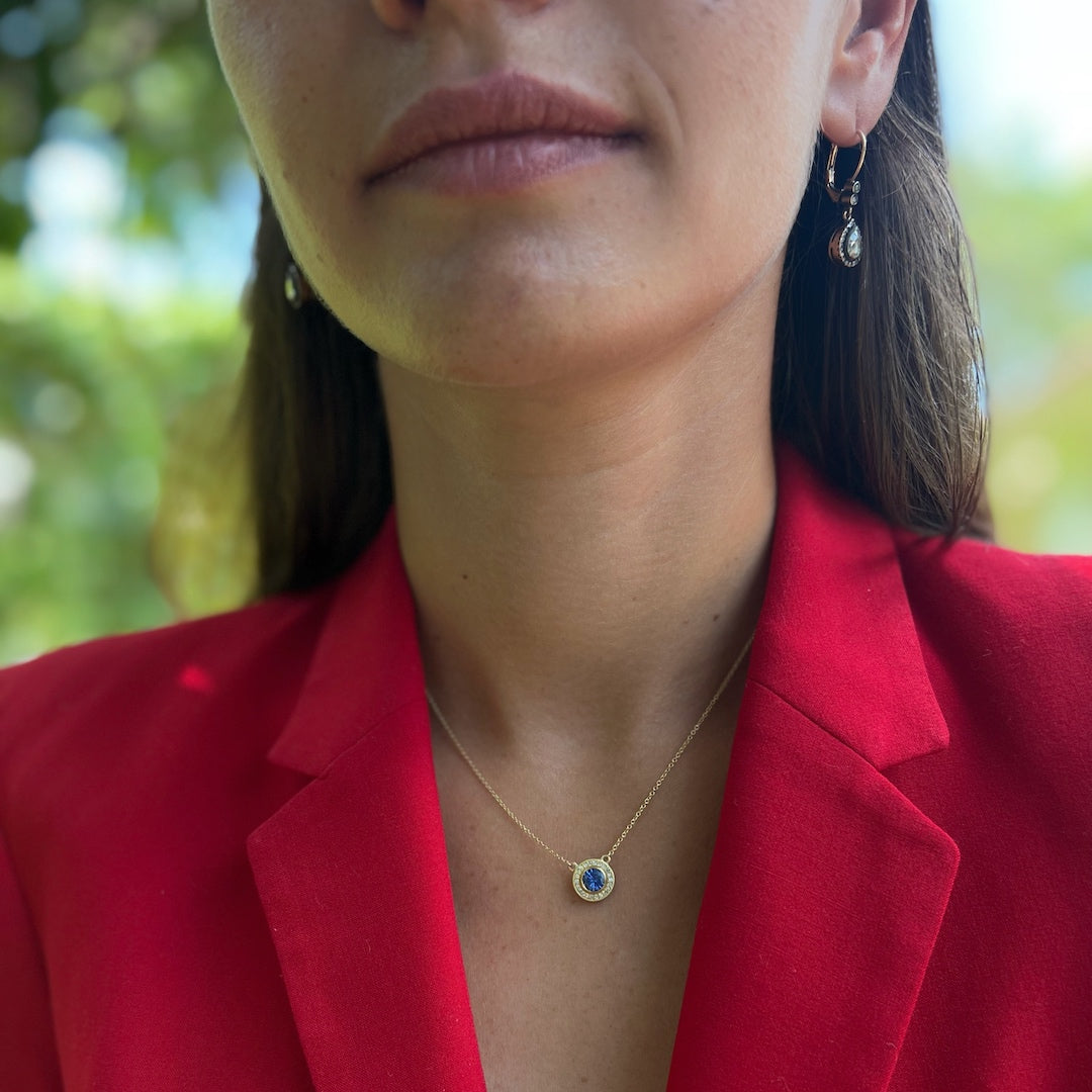 Model wearing the Elegant Sapphire Necklace, embodying confidence and elegance as she showcases the unique design and the enchanting beauty of the sapphire pendant.