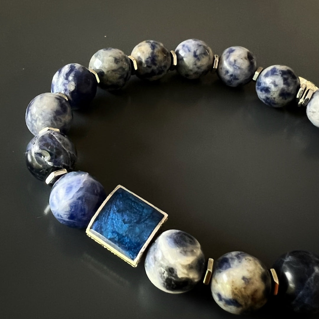 Blue Energy Talisman Bracelet - Handmade with sodalite, hematite, lapis lazuli, and a sterling silver fleur de lis charm, bringing tranquility and refinement