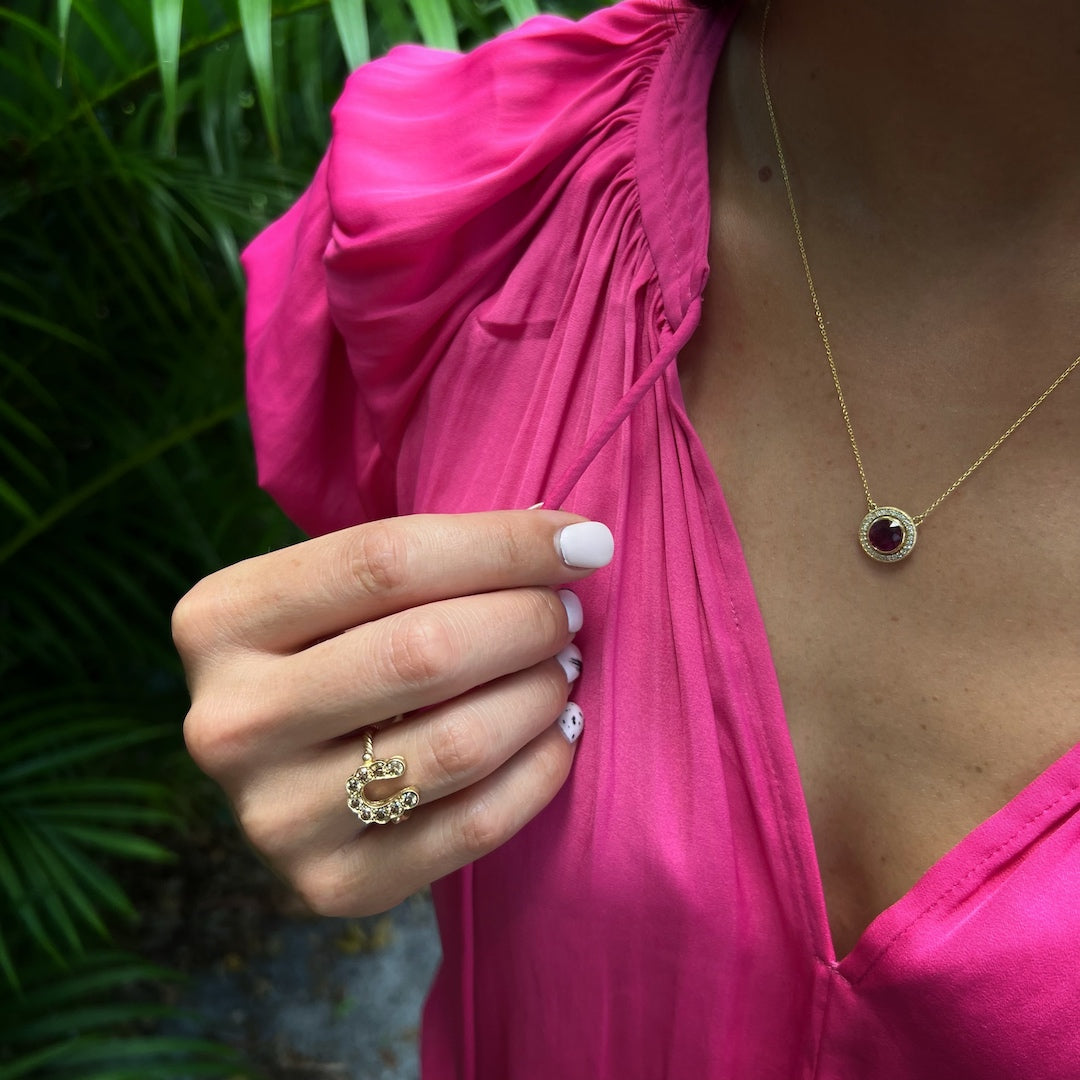 Hand Model Wearing Elegant Gold Ring - A captivating image of a hand model wearing the stunning gold and diamond horseshoe ring, creating a stylish and glamorous look.