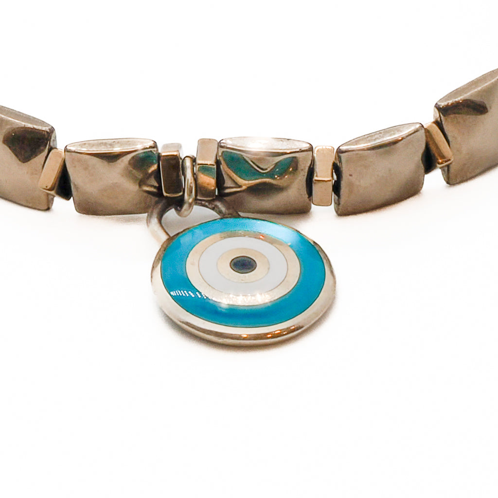 An image showcasing the handmade anklet with 6mm red crystal beads and a striking gold color hematite bead.