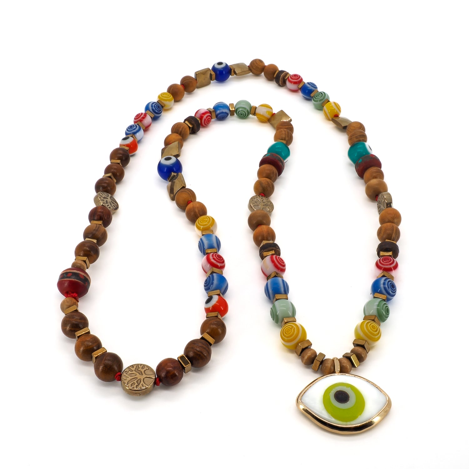 A close-up view of the Green Eye Beaded Necklace, showcasing the intricate details of the colorful glass evil eye beads, gold hematite stone beads, and tree of life beads. 