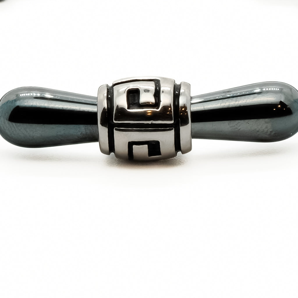 Close-up of the grey hematite teardrop beads, showcasing their unique texture and color.