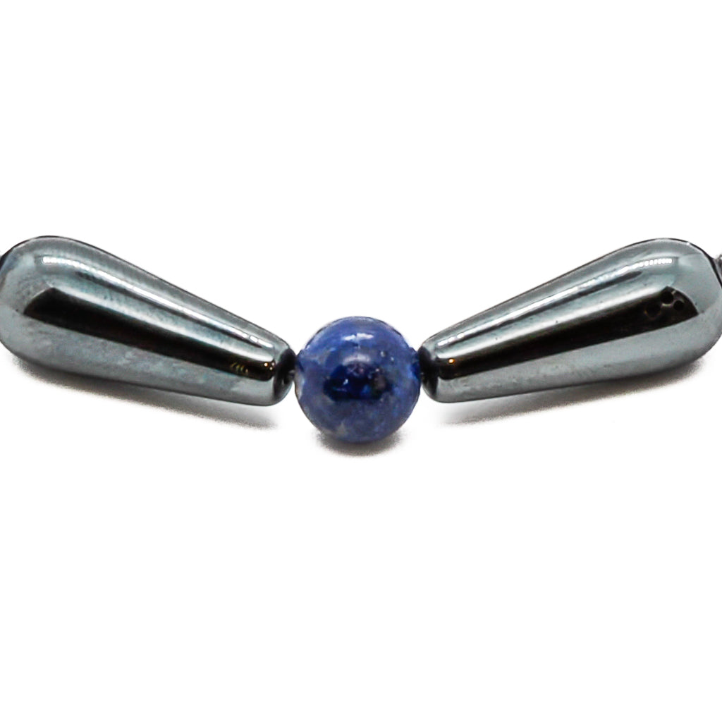 Discover the power of the Hematite Healing Bracelet, adorned with large hematite tube beads and blue lapis lazuli stones.