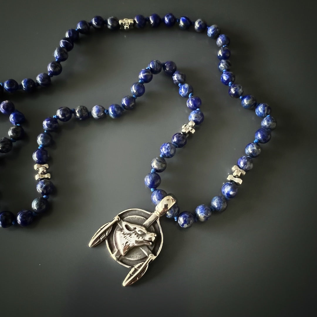 Embrace your wild side with the Lapis Lazuli Wolf Necklace.