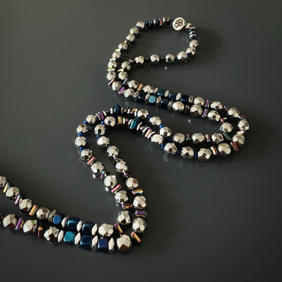 Embrace the positive vibes and make a bold fashion statement with the Light of Luck Diamond Necklace, adorned with hematite stones and a dazzling diamond pendant.