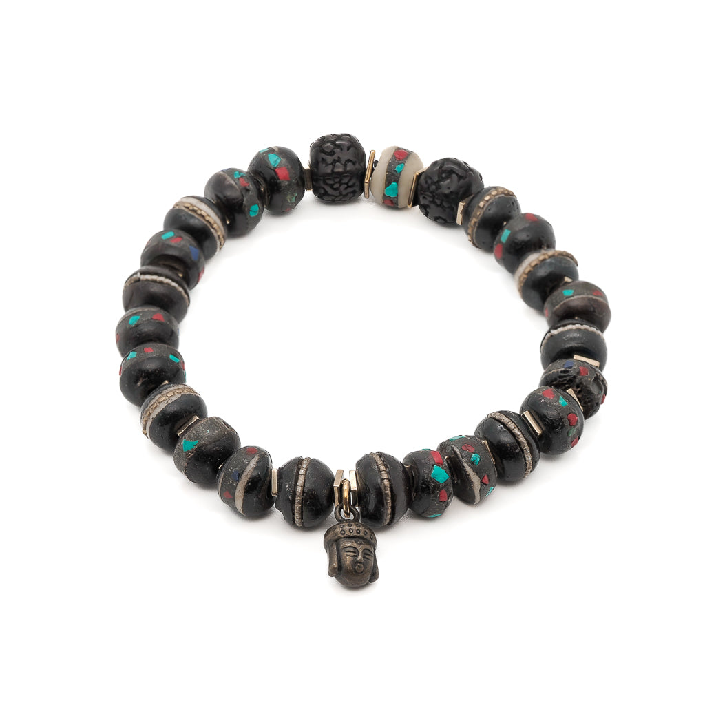 Experience tranquility with the Meditation Bracelet, featuring Nepal yak bone beads, seed beads, and a bronze Buddha charm.