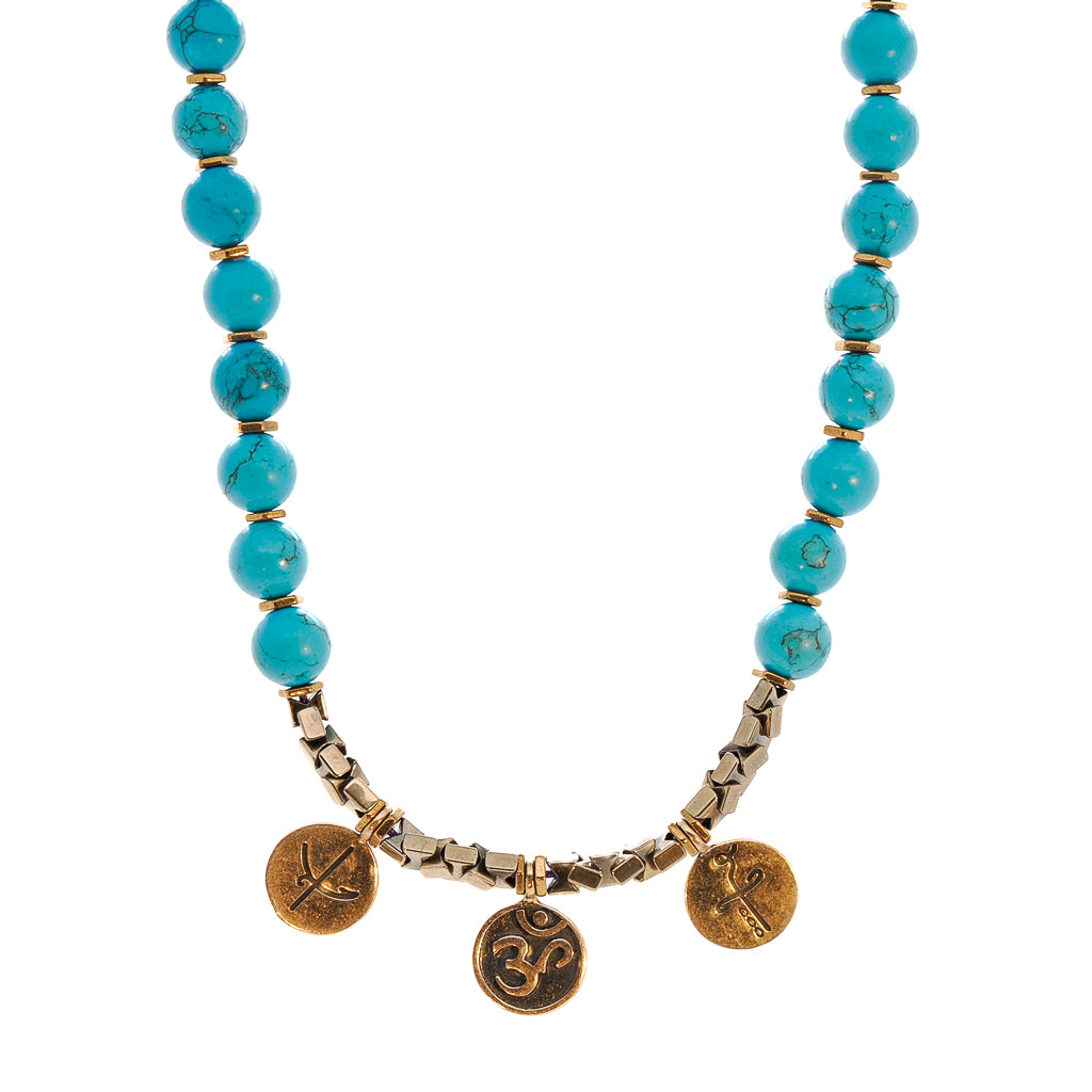 Gold vermeil evil eye turtle charm on the Mystic Meditation Necklace.