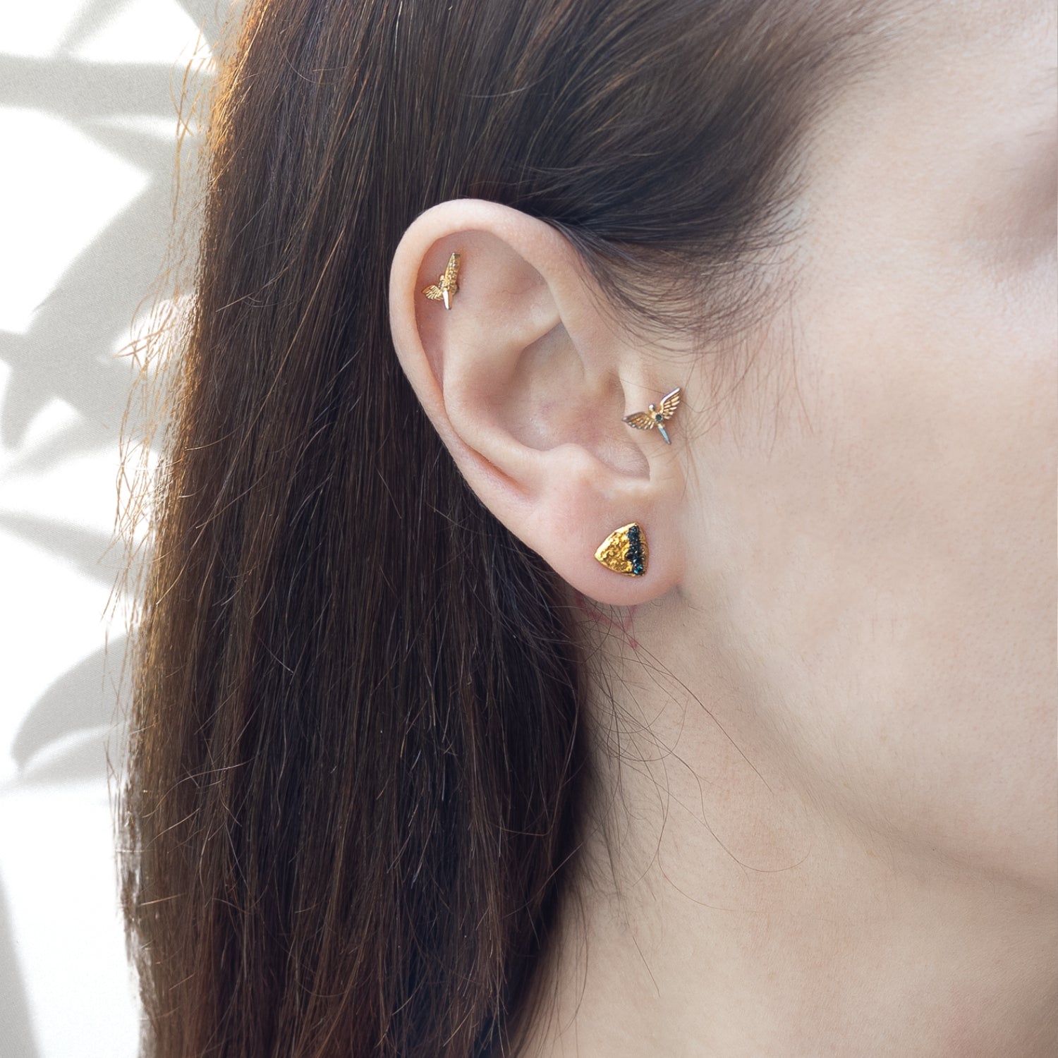 Model Wearing Nature Triangle Gold Diamond Stud Earring - Embracing elegance and style.