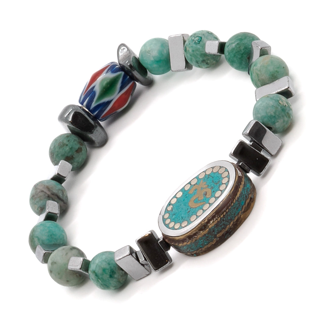Experience the spiritual essence of the Om Mystic Bracelet, adorned with silver hematite stone beads and a symbolic Om Mantra charm.