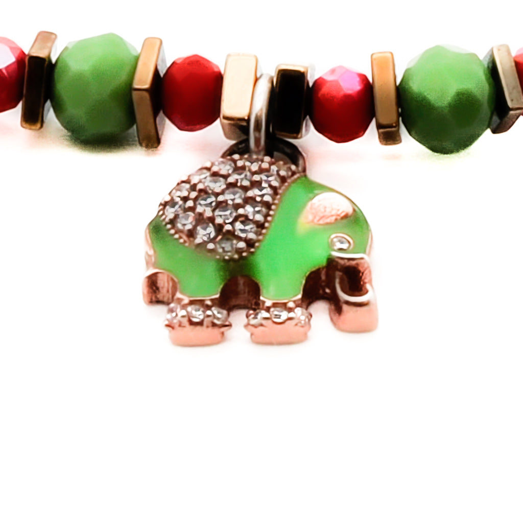 Embrace the symbolism and positive vibes of the Powerful Symbol Anklet, adorned with red crystal beads, green jasper beads, a gold color hematite floral bead, and silver charms representing protection, luck, and unity.