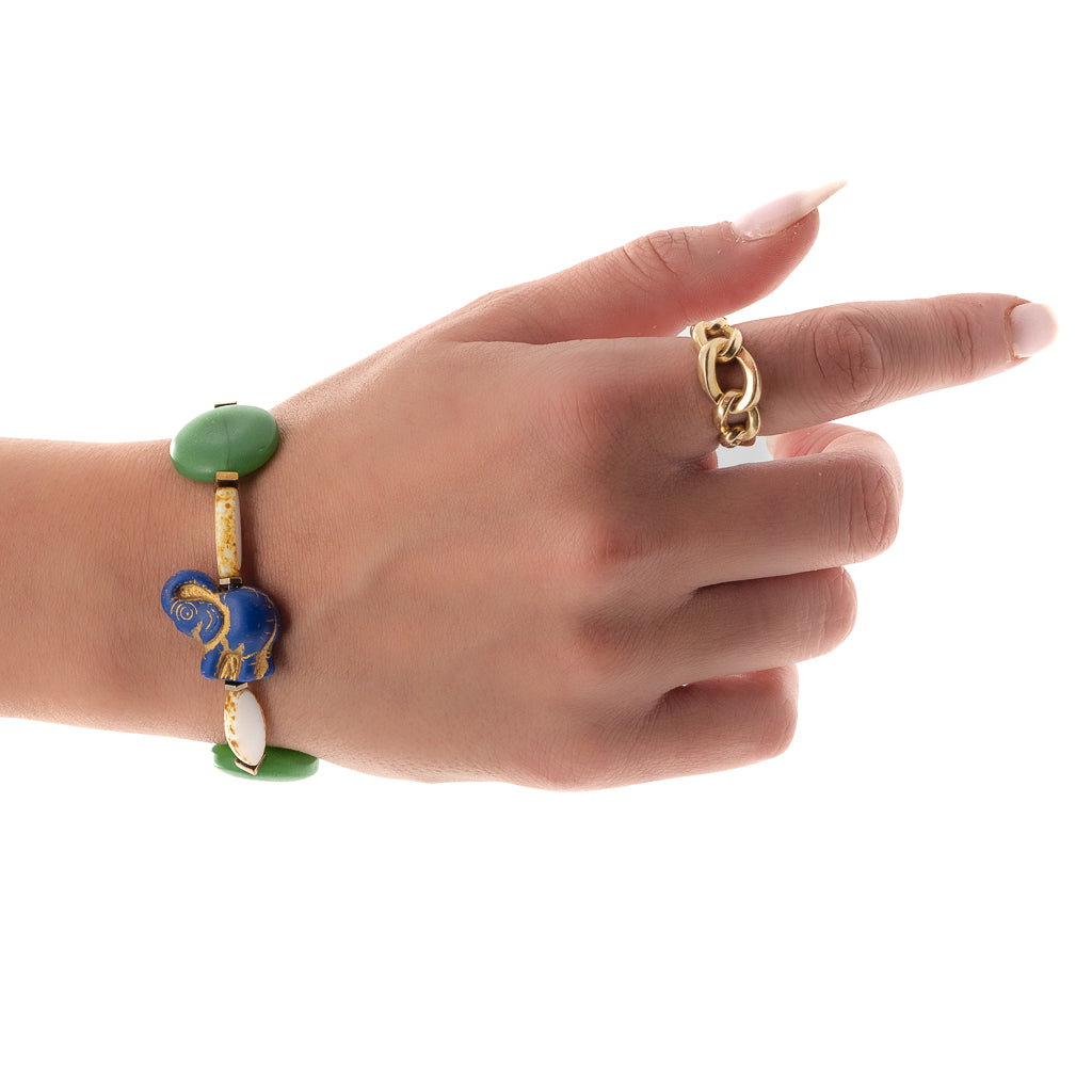 Hand model showcases the beauty of the Purple Elephant Bracelet, highlighting its vibrant colors and symbolic elephant bead.