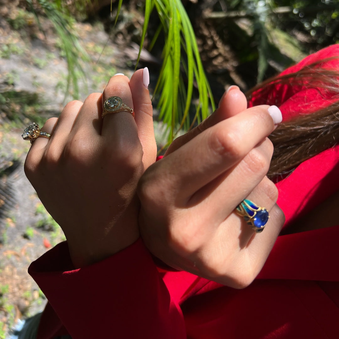 Regal Charm - Sapphire Flame Ring with 18k Yellow Gold brilliance.