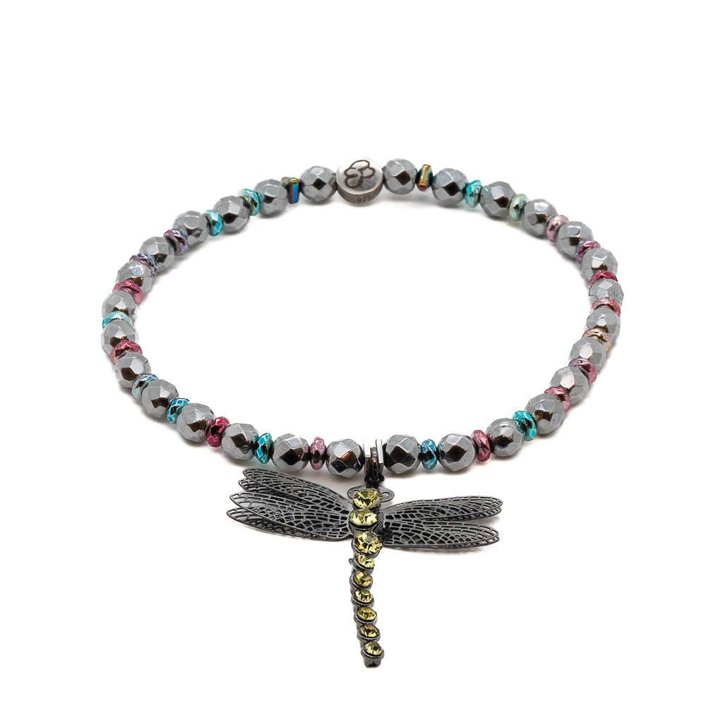 Embrace the symbolism of self-love and personal growth with the Self Love Dragonfly Anklet, featuring silver hematite stone beads, blue and pink hematite spacers, and a silver dragonfly charm, a meaningful and empowering accessory.