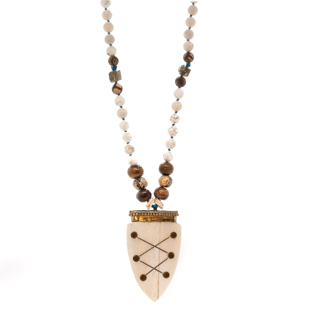 Explore the beauty of the Spirits on the Run necklace, a handmade jewelry piece with a unique and spiritual design.