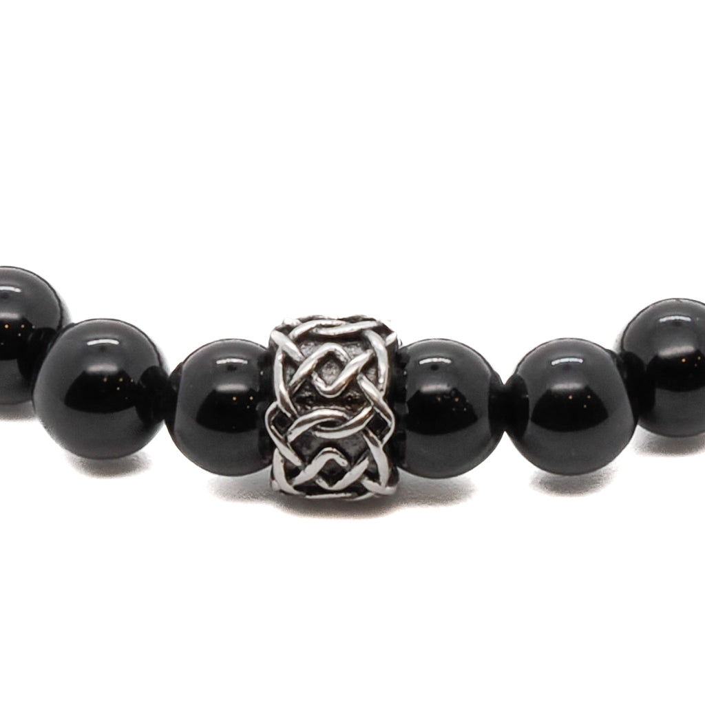 Handmade onyx bracelet offering stability and strength, accented by steel and hematite.