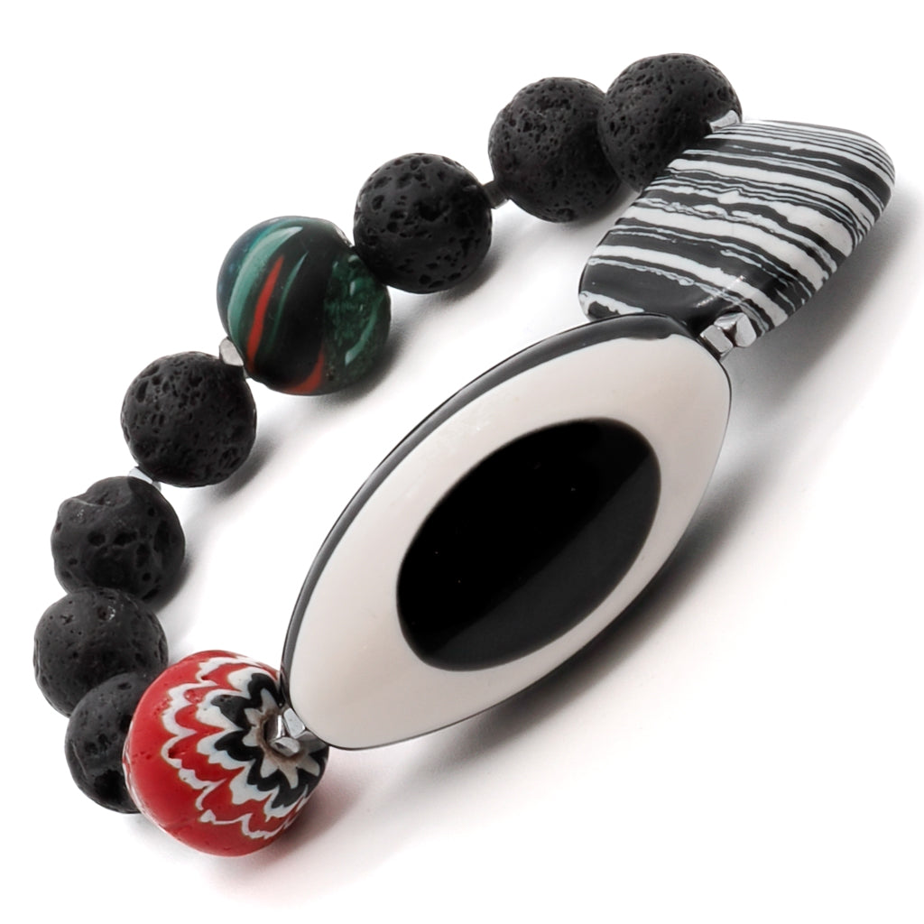 Immerse yourself in the beauty and symbolism of the Third Eye Bracelet, showcasing black and white stone beads and a stunning eye resin centerpiece.