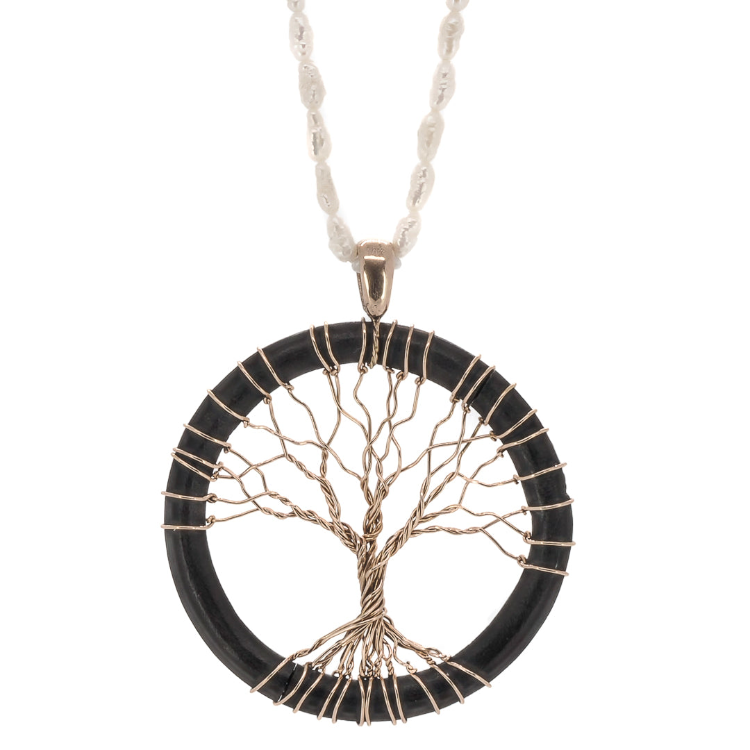 Timeless Symbolism - Tree Of Life Necklace representing growth and renewal.