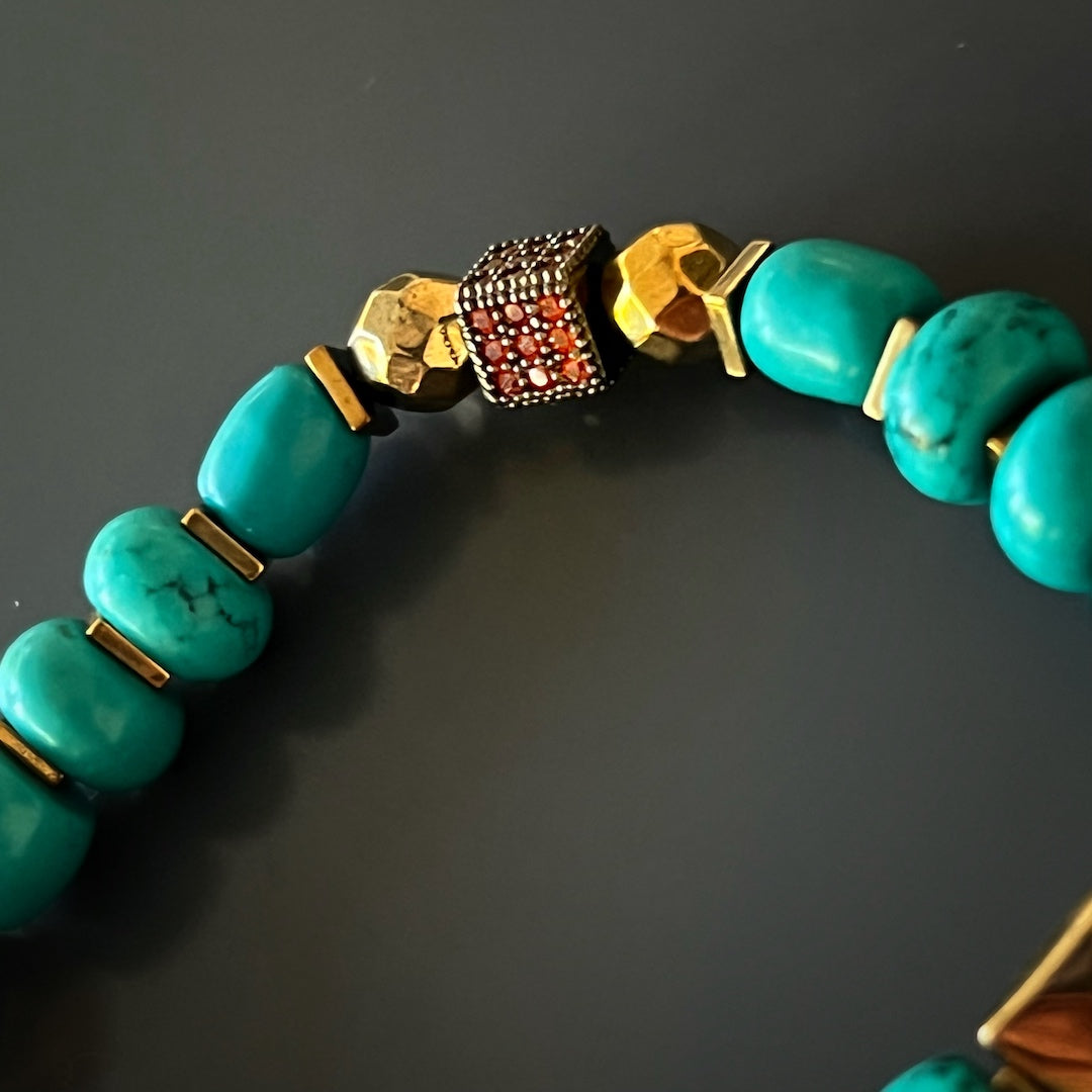 Invite the unique touch of the Turquoise Long Lash Bracelet, adorned with turquoise beads, a Swarovski crystal, hematite, and a protective brass evil eye charm.