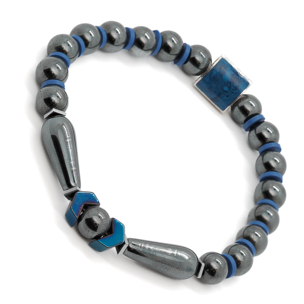 Handmade bracelet featuring natural hematite stones, sterling silver lapis bead, and blue details.