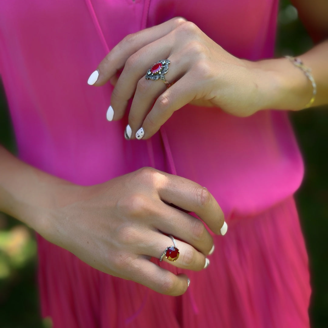 Model showcases Oval Ruby Ring - Diamonds symbolize love, making this ring a romantic addition to any outfit.