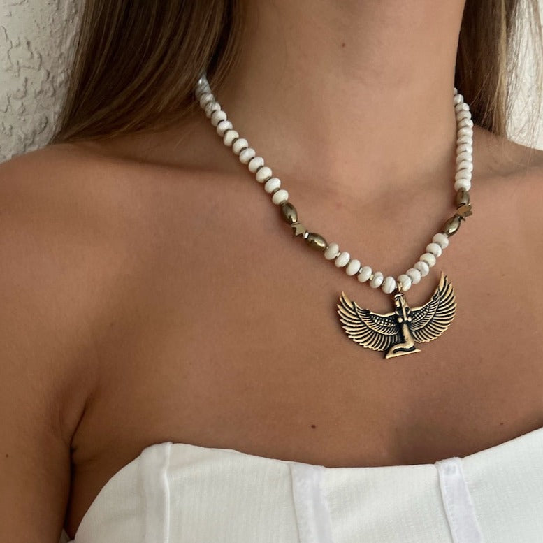 Model wearing White Isis Goddess Necklace, embodying feminine power.