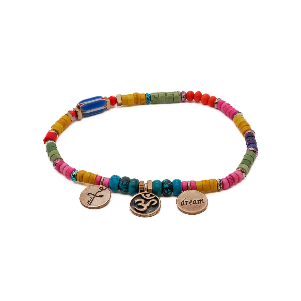 Colorful beaded ankle bracelet with Om, Dream, and Heal charms.