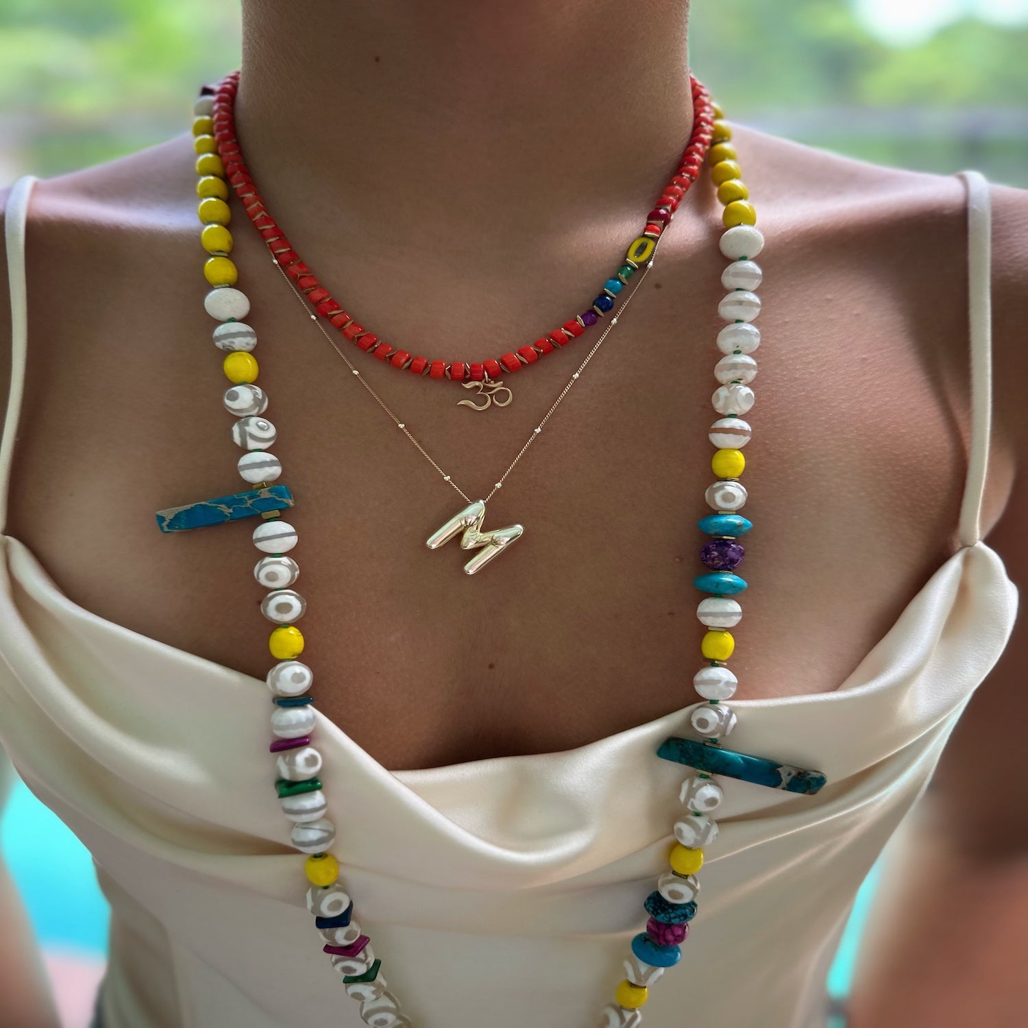 Model wearing the Chakra Necklace, exuding a sense of balance and spiritual connection with the vibrant chakra-colored beads.