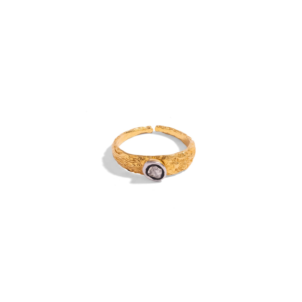 Hand textured gold band ring with a rose cut diamond set in an oxidized silver bezel