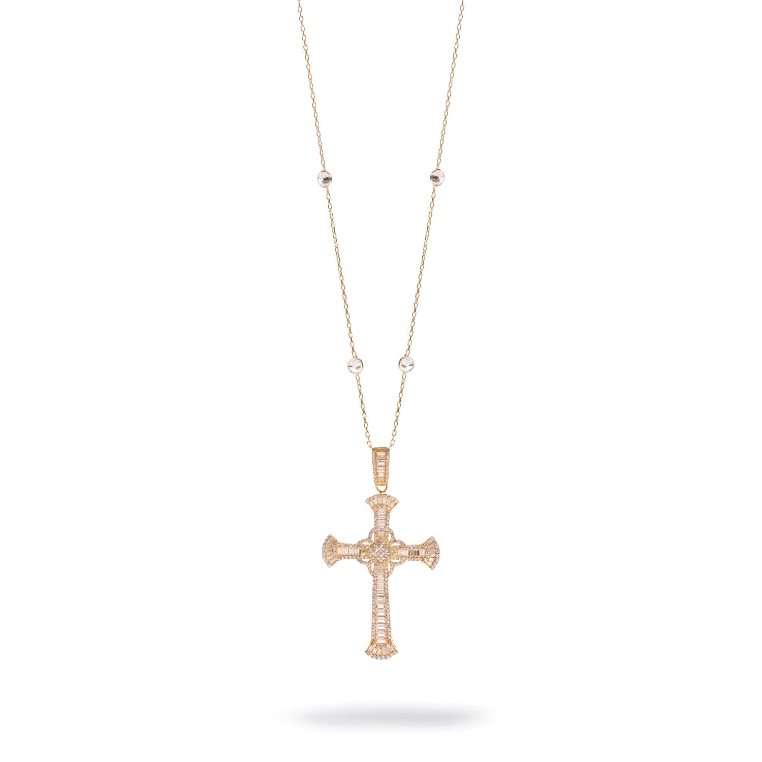 Gold station chain necklace with a large flared cross set in baguette cubic zirconia