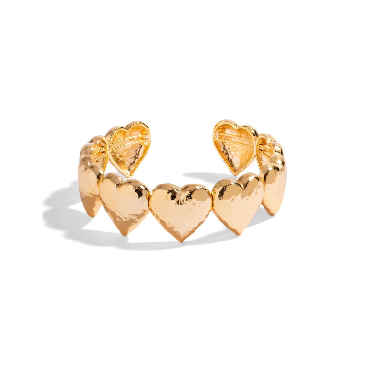 Gold cuff bracelet made of linked hammered puffed hearts