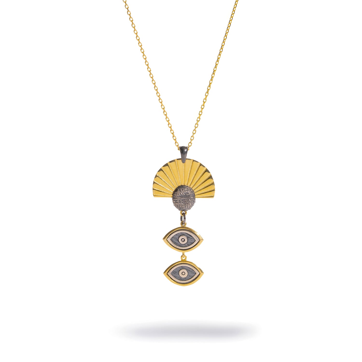 Sunray Ancient Eye Two-Tone Pendant Necklace laid flat, close view of the fluted gold sunray fan and oxidised silver coin