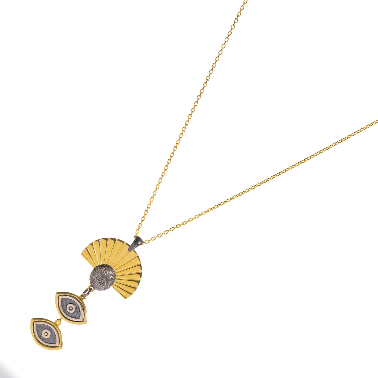 Sunray Ancient Eye Two-Tone Pendant Necklace laid flat at an angle, showing the gold chain and two-tone pendant