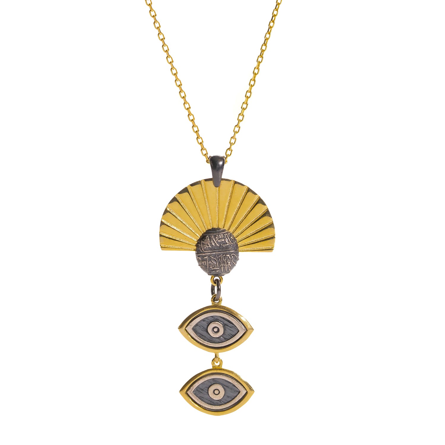 Close-up of the Sunray Ancient Eye pendant showing the engraved oxidised silver coin and gold sunray fan
