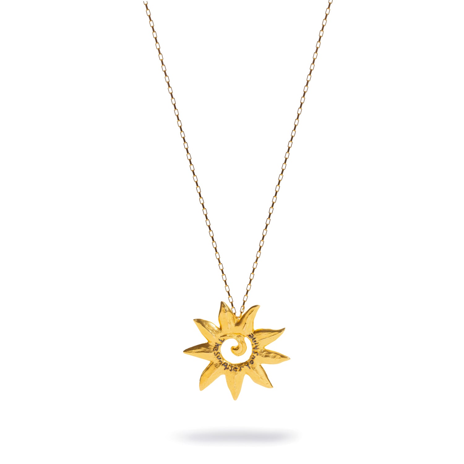 Gold sunburst spiral pendant necklace engraved with the words The Sun Rises, You Shine