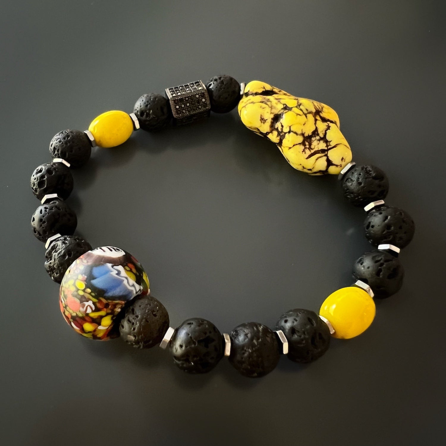 Raw yellow turquoise large bead serving as the focal point of the African Yellow Turquoise Bracelet, displaying its natural beauty and unique color variations.