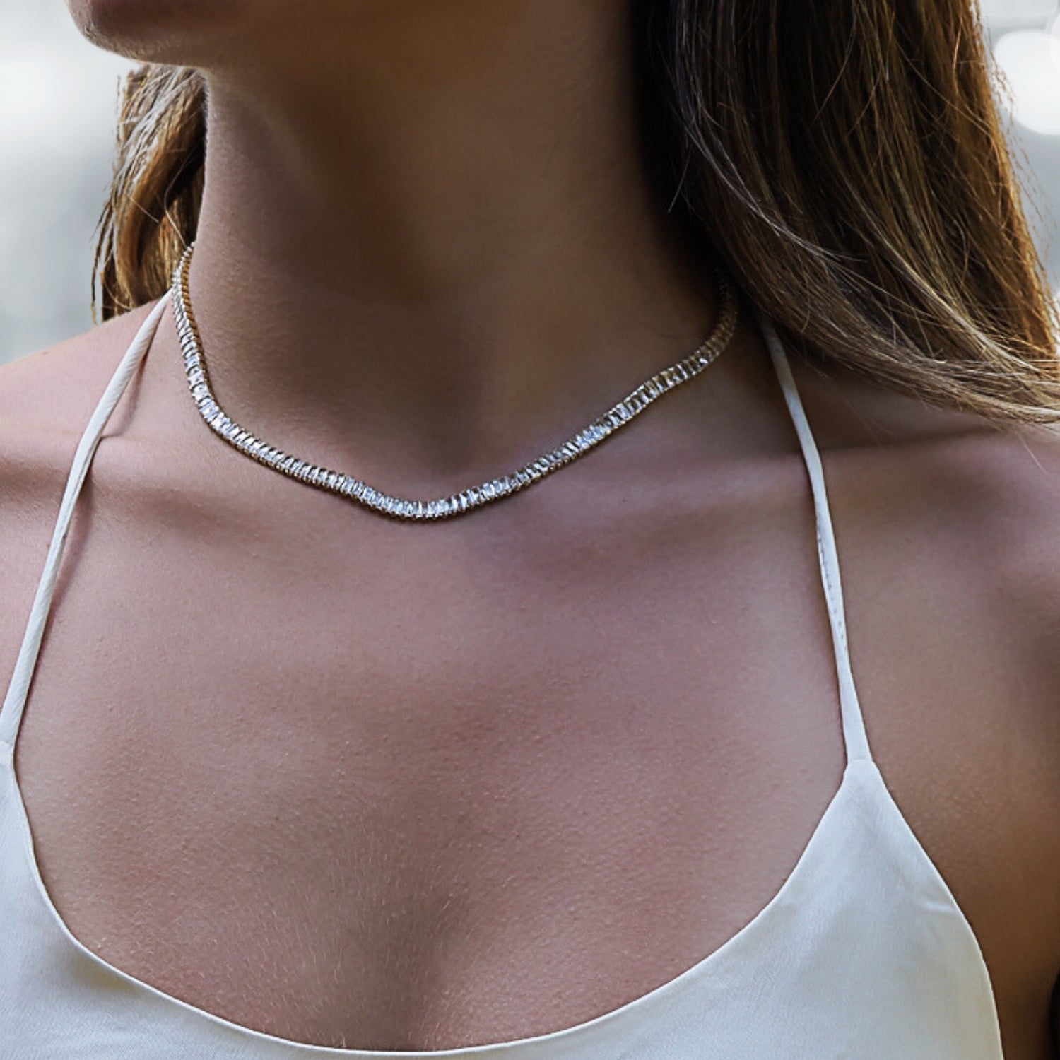 Model wearing the Baguette Diamond Gold Choker Necklace, exuding sophistication and confidence in this exquisite jewelry.