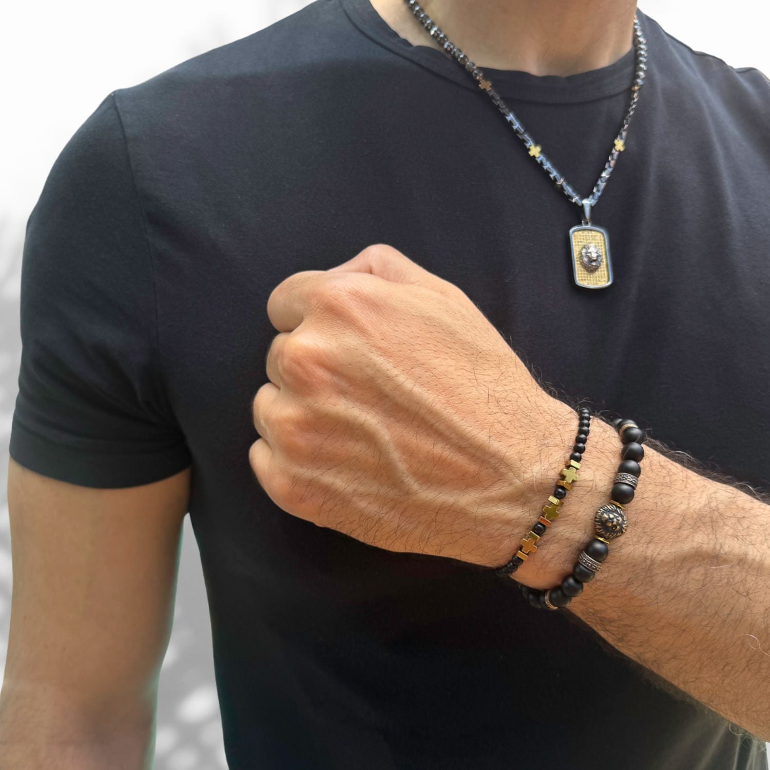 Men's Black Onyx Bead Bracelet with bronze spacers and a powerful lion charm symbolizing courage and leadership