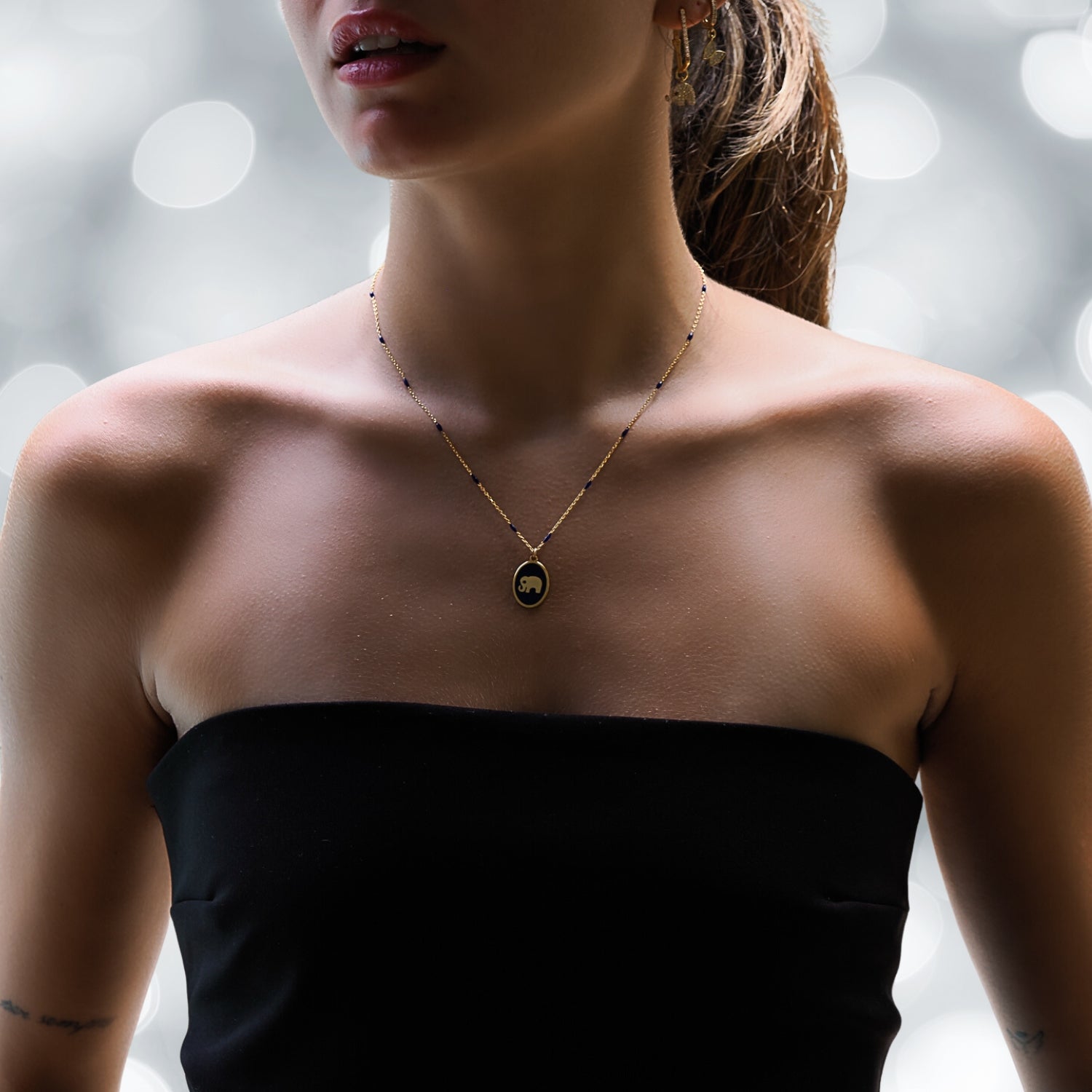 Model Adorning the Blue Enamel Chain Spirit Elephant Necklace - Elegance and Strength.