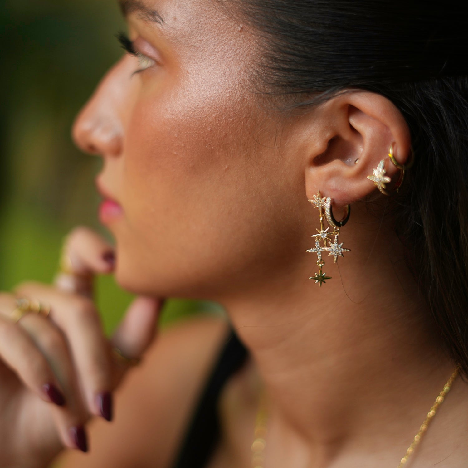 Gold-plated star earrings with CZ diamonds, offering a celestial flair and versatile styling options