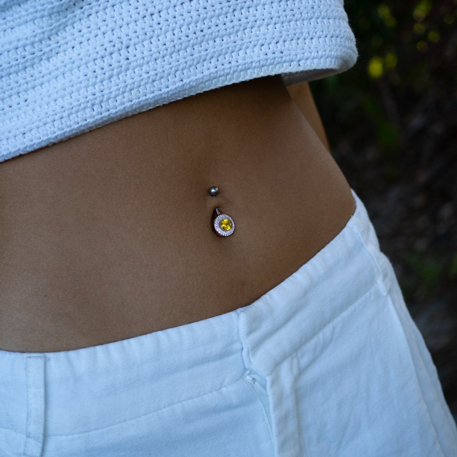 Sterling silver belly button piercing with oval citrine stone, CZ diamond halo, rose gold finish, vibrant yellow, sparkly, elegant style.