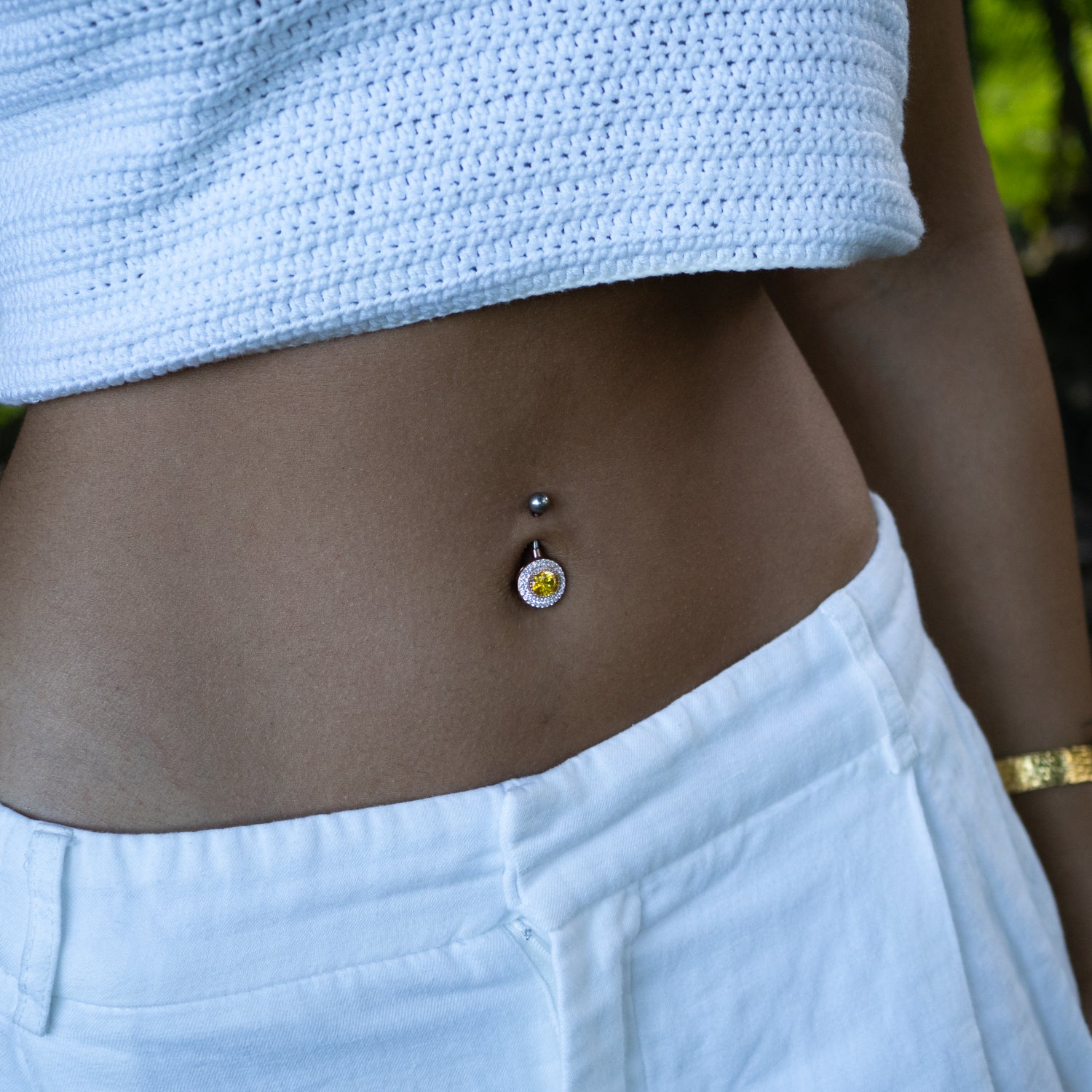 Sterling silver belly piercing with oval citrine gemstone, CZ diamond halo, rose gold finish, vibrant yellow, sparkling, elegant style.
